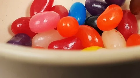 Jelly beans falling into container. Stock Footage 106721558