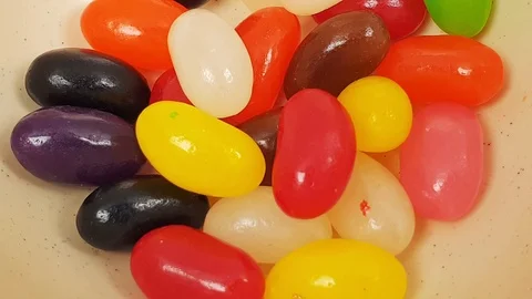 Jelly beans falling into container. Stock Footage 106721563