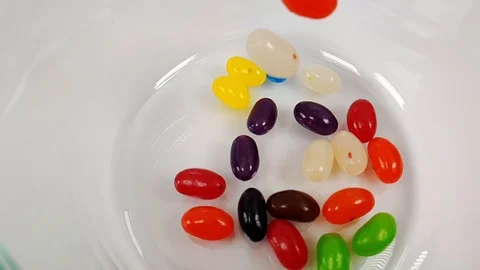 Jelly beans falling in slow motion 240fps Stock Footage 106695276