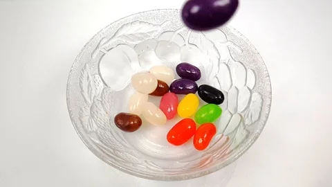Jelly beans falling in slow motion 240fps Stock Footage 106695277
