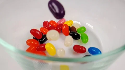 Jelly beans falling in slow motion 240fps Stock Footage 106695296