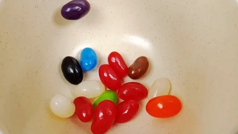 Jelly beans falling in slow motion 240fps Stock Footage 106695297