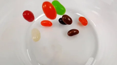 Jelly beans falling in slow motion 240fps Stock Footage 106695302