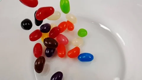 Jelly beans falling in slow motion 240fps Stock Footage 106695308