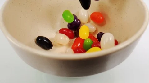 Jelly beans falling in slow motion 240fps Stock Footage 106695319