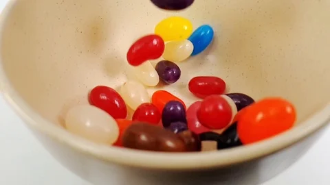 Jelly beans falling in slow motion 240fps Stock Footage 106695329