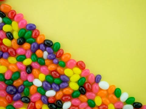 Jelly Beans Frame and Background ( Yellow Background ) Stock Photos