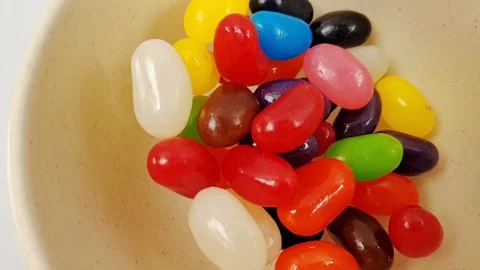 Jelly beans jumping in slow motion 240fps Stock Footage 106695357