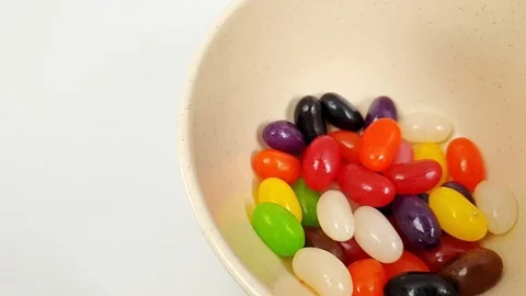 Jelly beans jumping in slow motion 240fps Stock Footage 106695360
