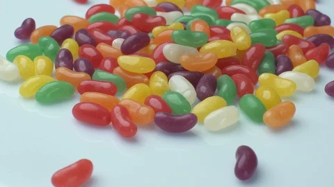 Jelly beans on a white table Stock Footage 87512271