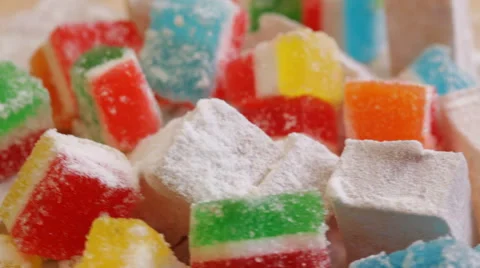 Jelly candy with turkish delight on rotating stand - closeup Stock Footage 50976118