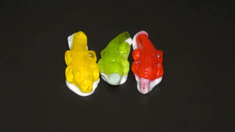 Jelly in the form of crocodiles melted in a pan Stock Footage 104869629