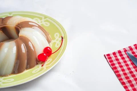Jelly Pudding garnished with Cherry Stock-Fotos