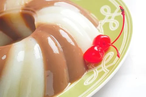 Jelly Pudding garnished with Cherry Foto stock