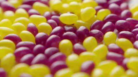 Jellybeans Rotating Loop off centre yellow and purple Stock Footage 141095759