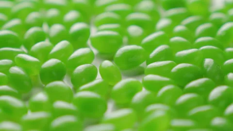 Jellybeans Rotating Loop Green off centre Stock Footage 141097009
