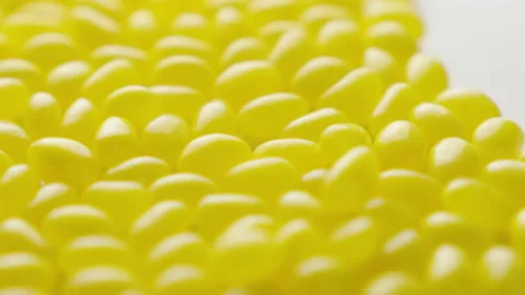 Jellybeans Rotating Loop yellow off centre Stock Footage 141097002