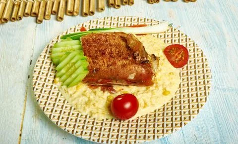 Jerk cod  creamed corn Foto stock