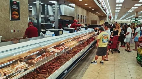 Jerky counter with customers inside buc ees store florida usa Stock Footage 315758911