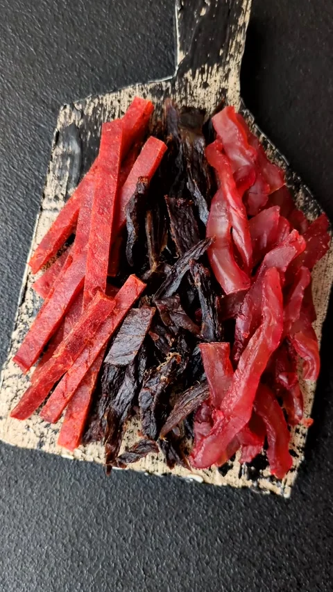 Jerky, dried fish in the form of sticks with salt, spices and herbs Stock Footage 302339428