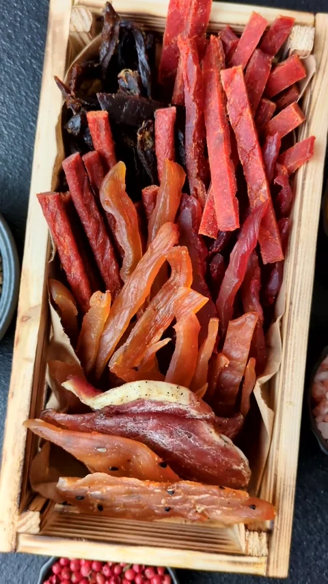 Jerky, dried fish in the form of sticks with salt, spices and herbs Stock Footage 303442649
