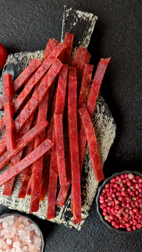 Jerky dried fish sticks with salt and spices Stock Footage 302116902