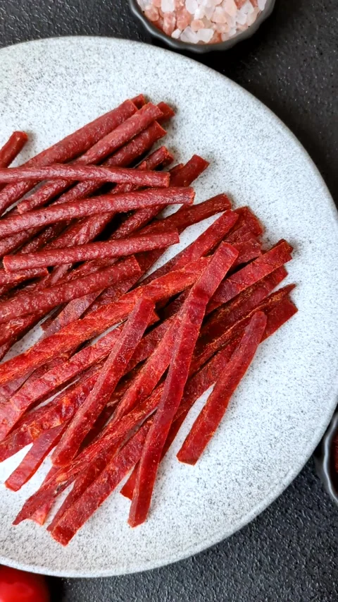 Jerky dried fish sticks with salt and spices Stock Footage 302116929