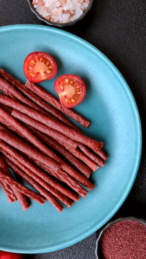 Jerky dried fish sticks with salt and spices Stock Footage 302116937