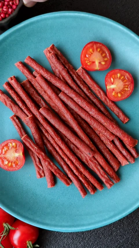 Jerky dried fish sticks with salt and spices Stock Footage 302116939