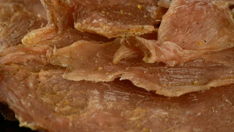 Jerky, dried meat with spices, 4K footage, rotating, close up 스톡 동영상 86408928