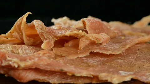 Jerky, dried meat with spices, 4K footage, rotating, close up Stock Footage 86409737
