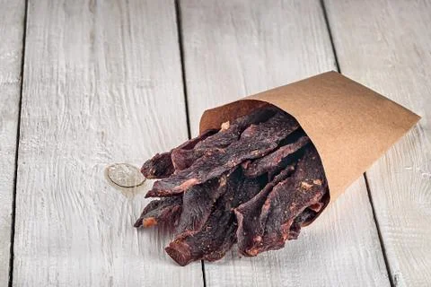 Jerky in a paper bag Stock Photos