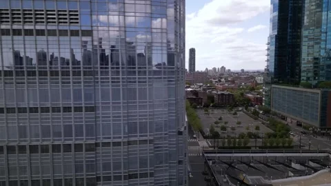 Jersey city downtown. camera move to the left park and glass tower. city tram Stock Footage 240686677