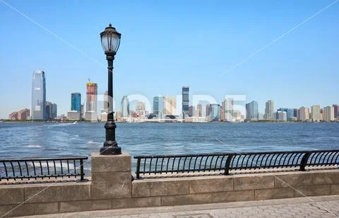 Jersey City skyline seen from downtown New York on a sunny day. Stock Photos