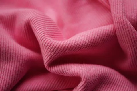 Jersey pink fine ribbed pattern, soft wrinkled fabric. Stock Photos
