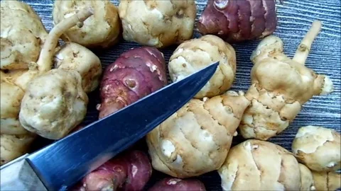 Jerusalem artichoke is very useful in terms of health, in the plate Vídeos de archivo 86202876