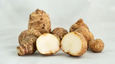 Jerusalem artichokes on white background Stock Photos