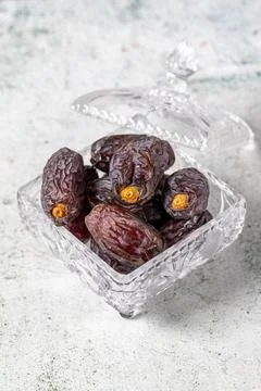 Jerusalem date fruit on stone background. Dried Big date fruit in a glass bow Stock Photos