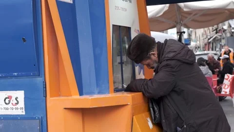 Jerusalem, Israel, Dec, 28, 2022. Jewish man in the lottery stand gambling and Stock Footage 228738011