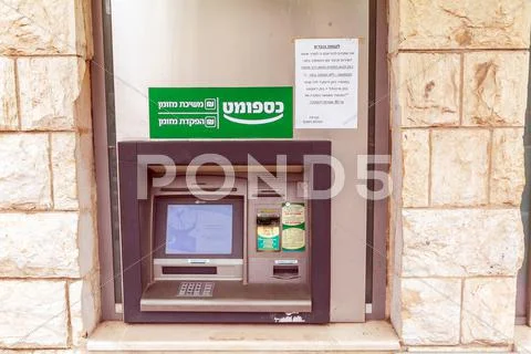 JERUSALEM, ISRAEL - FEBRUARY 19, 2013:ATM on a city street Stock Photos