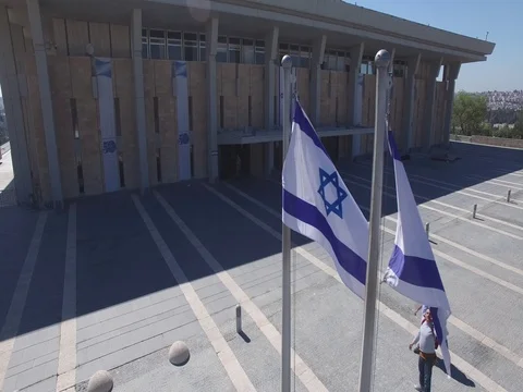 JERUSALEM ISRAEL Knesset branch of the Israeli government waving national flag Stock Footage