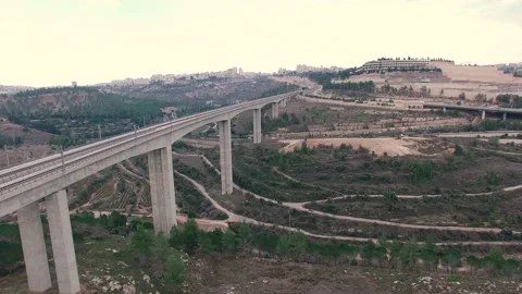 Jerusalem passing over train bridge with highway on background Stock Footage 143143443