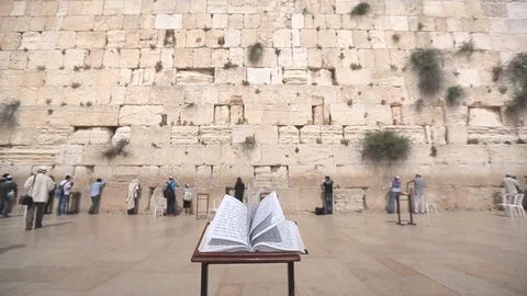 Jerusalem Wailing Wall Hebrew bible book dolly in Stock Footage