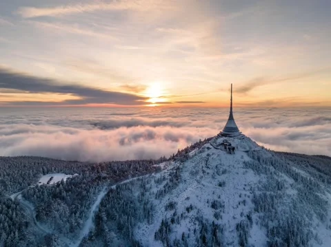Jested tower hyperlapse mountain hill with snow mist and fog at golden hour Stock Footage 231644268