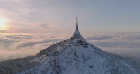 Jested tower mountain hill with snow mist and fog at golden hour Stock Footage 231564133