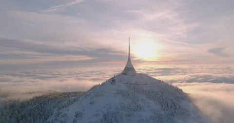 Jested tower mountain hill with snow mist and fog at golden hour Stock Footage 231567488