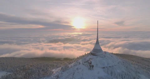 Jested tower mountain hill with snow mist and fog at golden hour Stock Footage 231567507