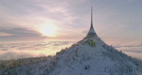 Jested tower mountain hill with snow mist and fog at golden hour Stock Footage 231570018