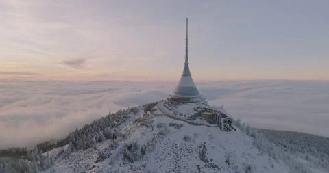 Jested tower mountain hill with snow mist and fog at golden hour Stock Footage 231570036