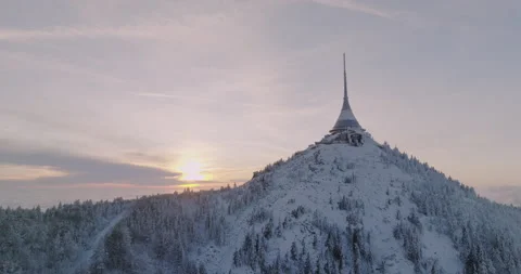 Jested tower mountain hill with snow mist and fog at golden hour Stock Footage 231571427
